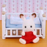 Sylvanian Families: Chocolate Rabbit Baby and Crib Bed Set.